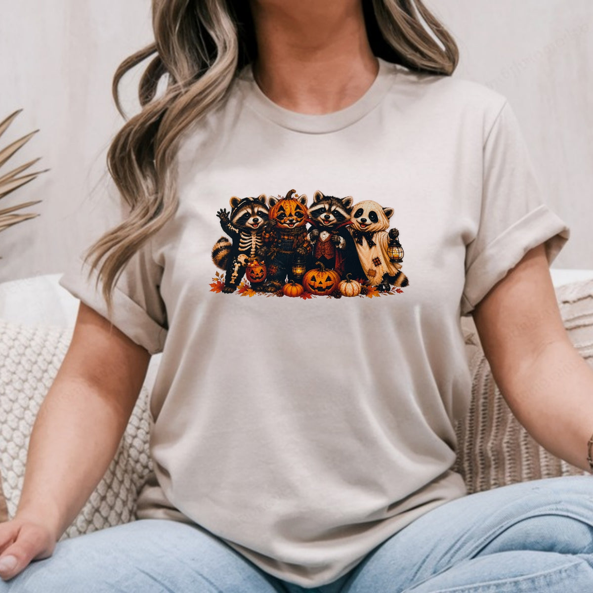 Sand Gildan Softstyle tee mockup with Halloween raccoons in skeleton, pumpkin and ghost costumes