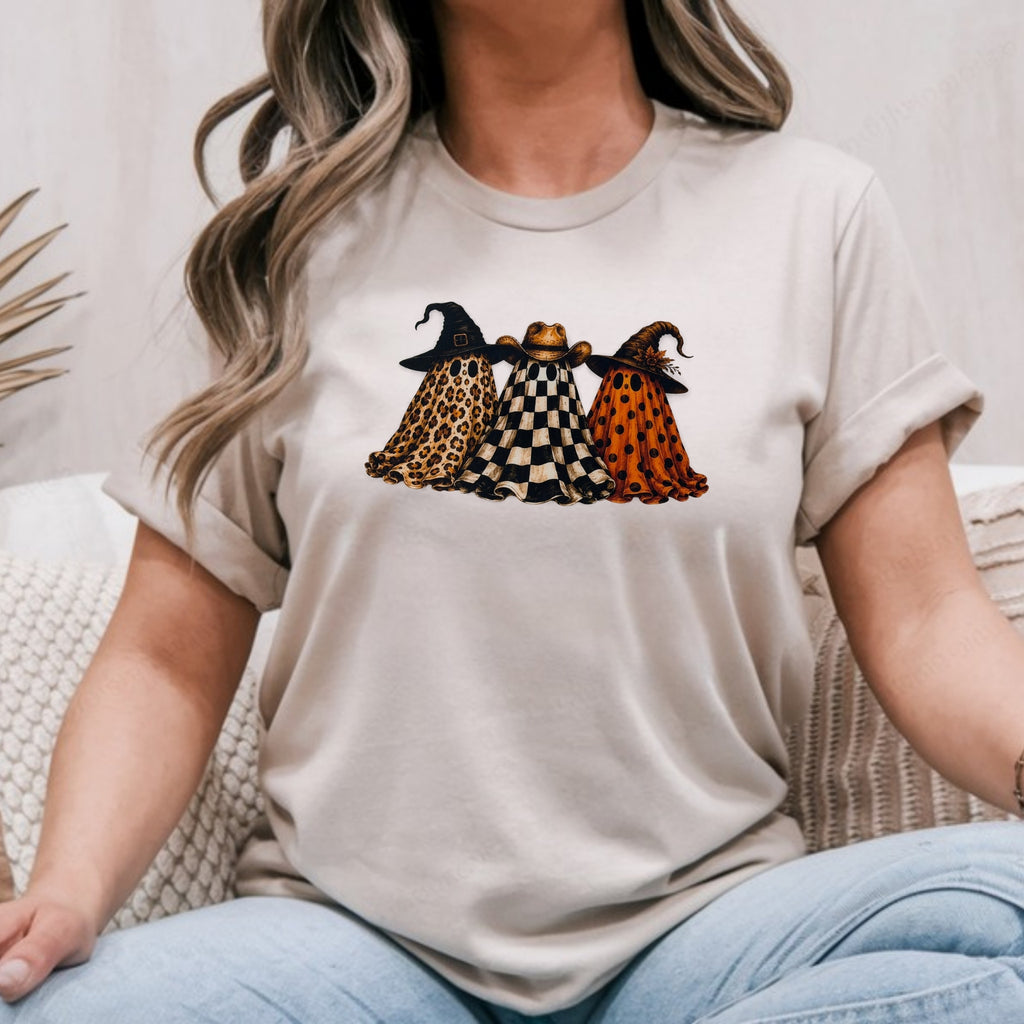 Sand Gildan Softstyle tee mockup with three ghosts in leopard, checkered and orange polka dot wearing witch and cowboy hats