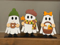 Hand-painted fall ghost trio shelf sitter on a wood shelf